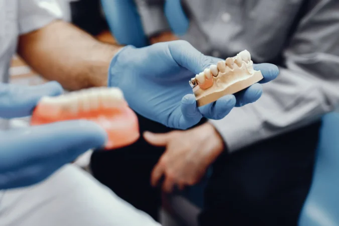 What is dental prosthetic treatment and how is it performed?